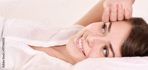 Young beautiful woman waking up