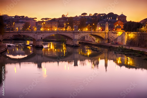 Rome bridge panorama with Tiber river view at dusk