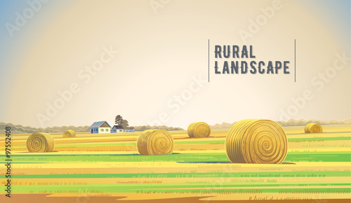 Countryside landscape with hay and village.