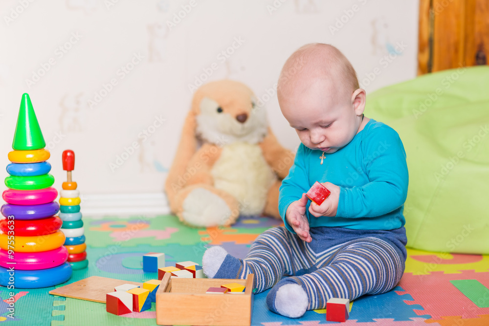 Cute little baby playing with colorful toys Cute little baby playing with colorful toys