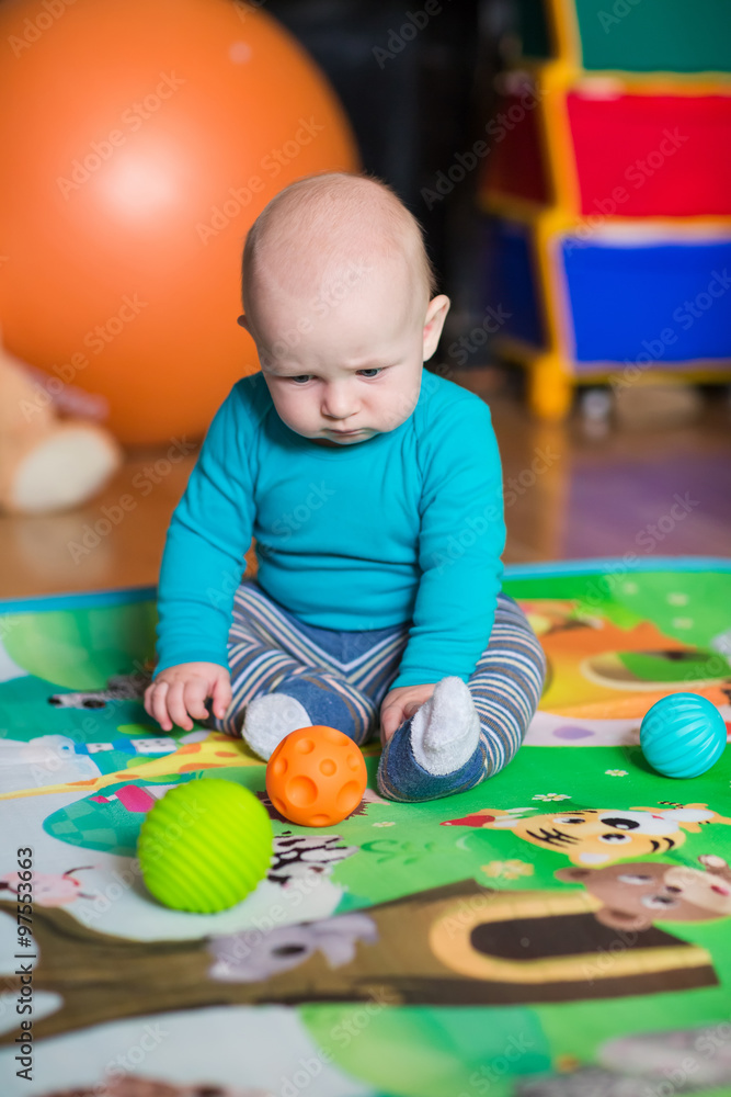 Cute little baby playing with colorful toys Cute little baby playing with colorful toys