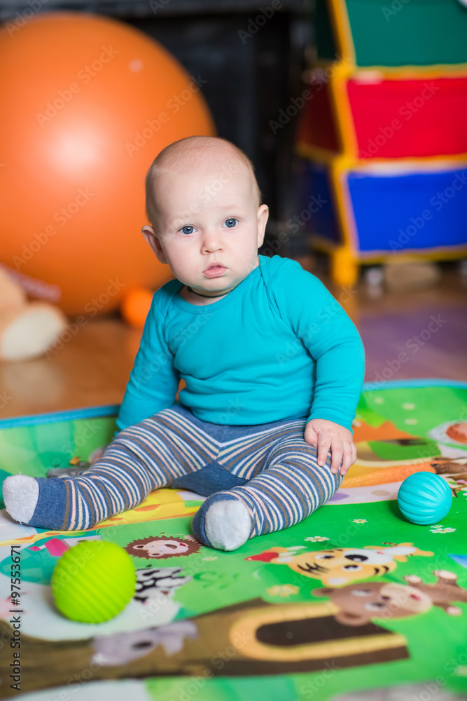 Cute little baby playing with colorful toys Cute little baby playing with colorful toys