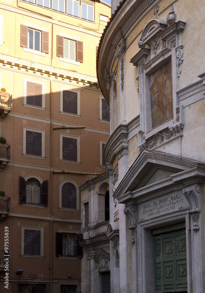 Close up of the entrance of San Bernardo alle Terme church in Rome, with the surroundings buildings in Rome
