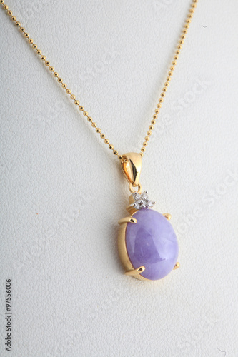 Purple Jade pendant and gold necklace isolated on white backgrou