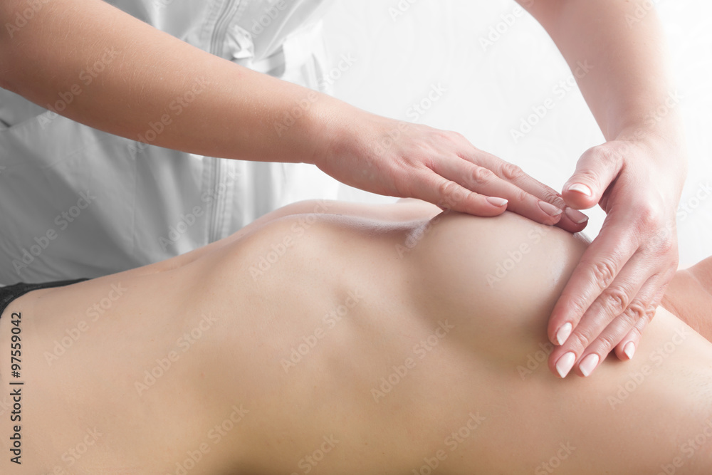 Beauty young woman recieving breast massage at spa. masseur's hands on the  woman's breast Stock Photo | Adobe Stock