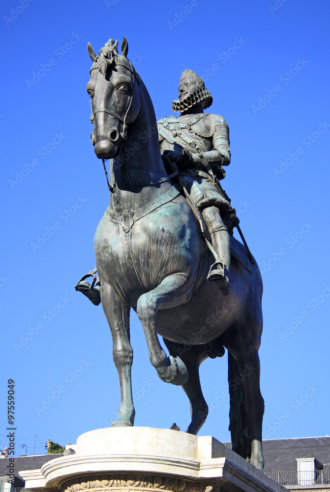 MADRID, SPAIN - AUGUST 23, 2012: Bronze equestrian statue of King Philip III from 1616 at the Plaza Mayor in Madrid, Spain.