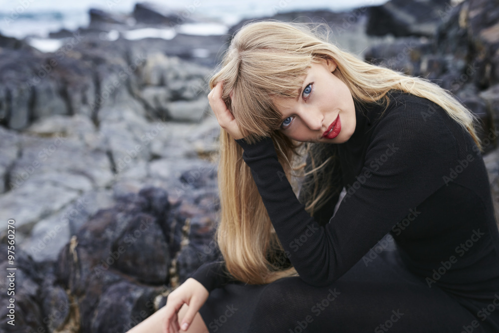 Blue eyed blond woman in black dress, portrait Blue eyed blond woman in black dress, portrait