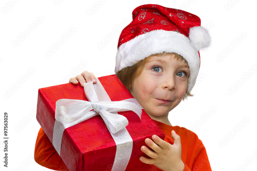 Cute kid with a Santa hat holding a present box Cute kid with a Santa hat holding a present box