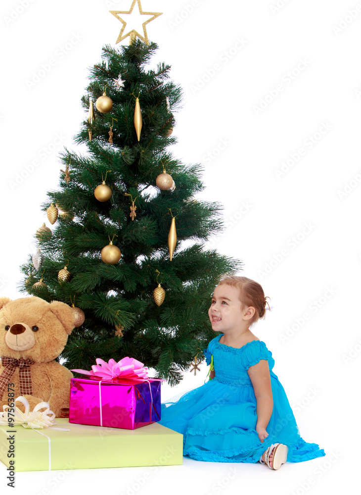 elegant girl near the Christmas tree