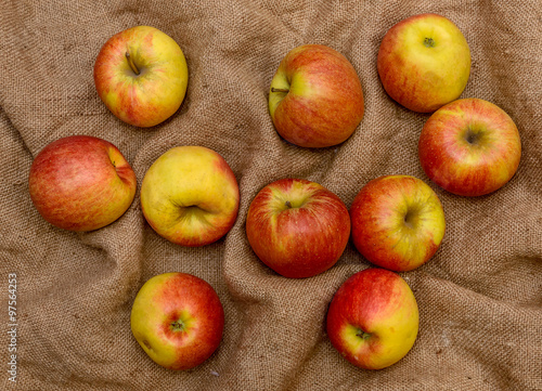 Top view of apples over sack background