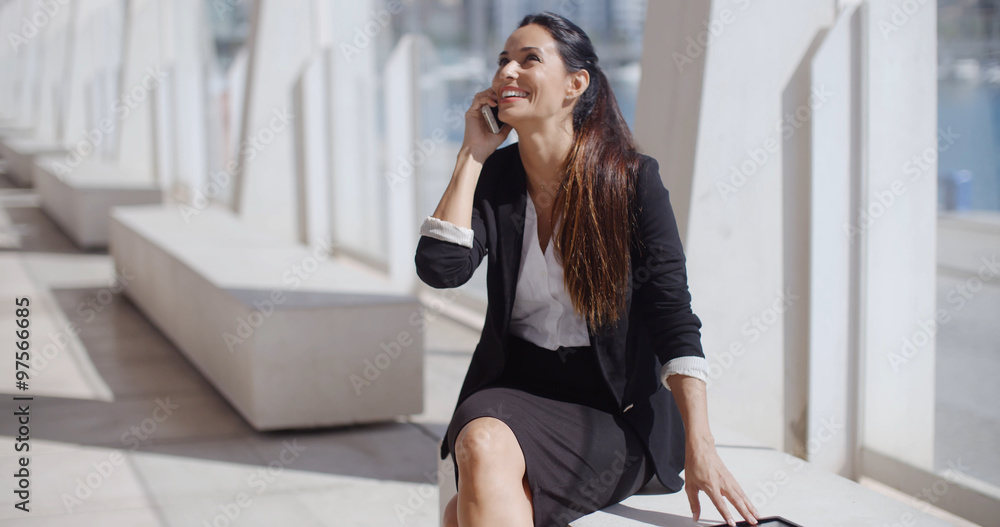 Young businesswoman talking on her smartphone Young businesswoman talking on her smartphone