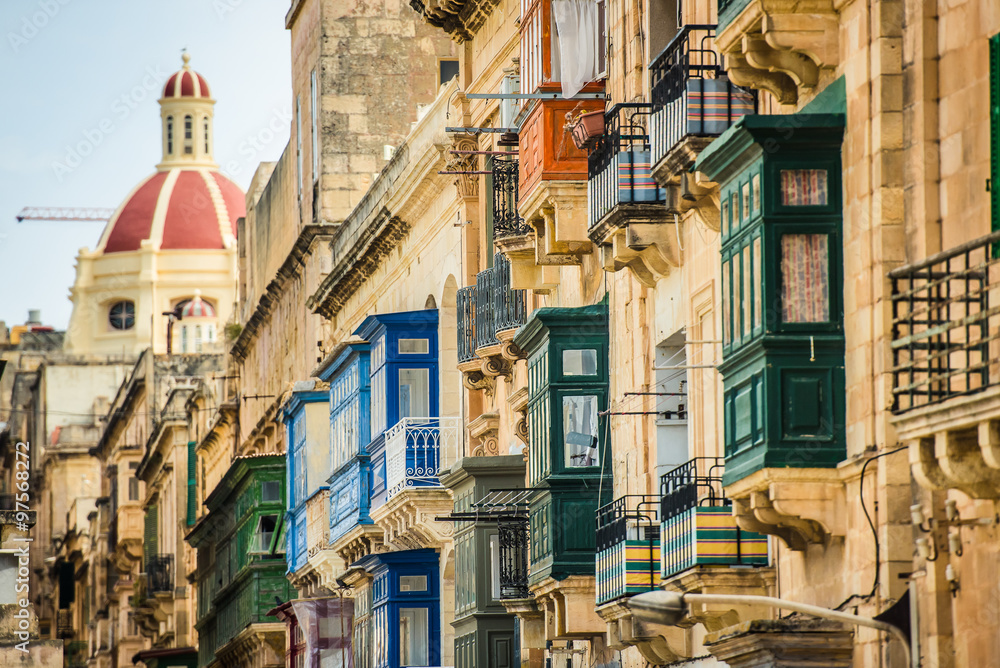 Valletta street with traditional colorful balconies