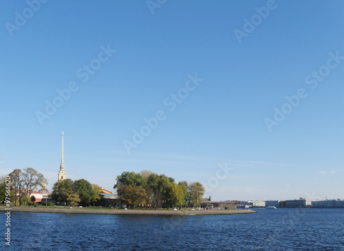 autumn views of Zayachy island on Neva river with spire of Peter and Paul cathedral