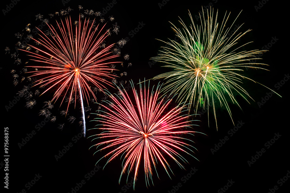 Colorful fireworks of various colors on black background