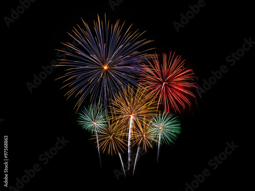 Colorful fireworks of various colors on black background