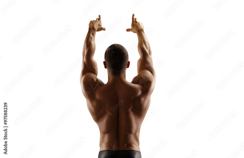 Muscular man standing with his back lifting his hands up. Isolate.