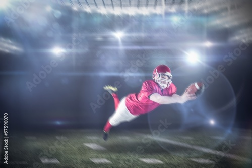 Fototapeta Naklejka Na Ścianę i Meble -  Composite image of american football player scoring a touchdown