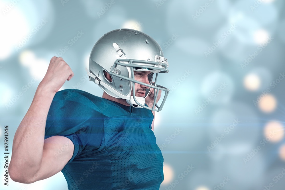 Confident american football player flexing muscles Confident american football player flexing muscles