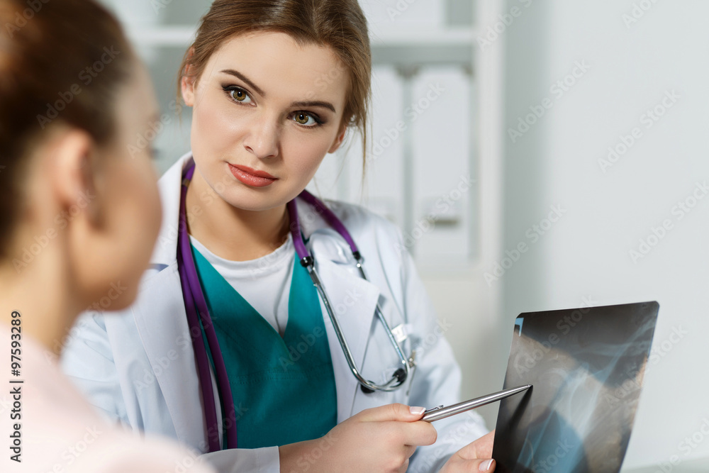 Female medicine doctor explains to patient diagnosis Female medicine doctor explains to patient diagnosis