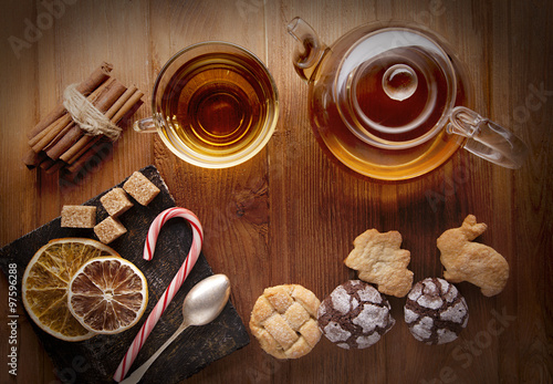 tea sweet sugar cookies on wooden table (top view)