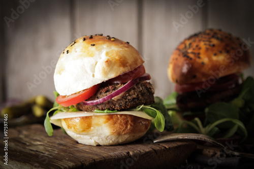 homemade veggie burger in a bun with sesame seeds of beer. delic