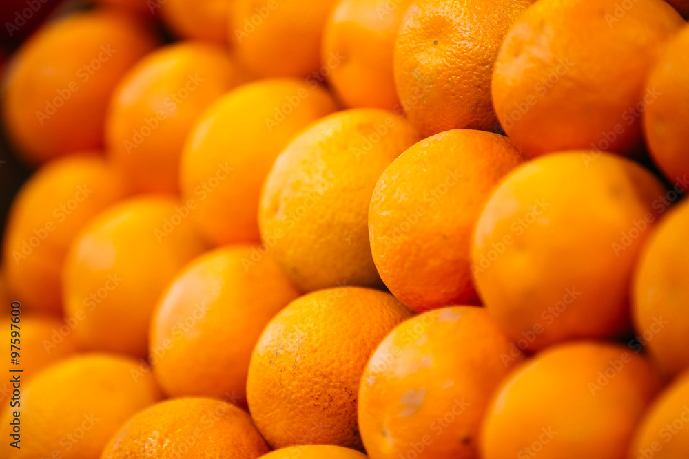 Ripe oranges forming background on farmers market Ripe oranges forming background on farmers market