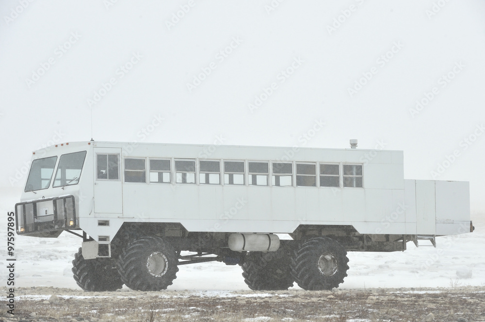 The all-terrain vehicle for snow trips to a snow blizzard in the tundra. Special car for the Arctic safari.