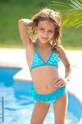 portrait of little girl outdoors in summer