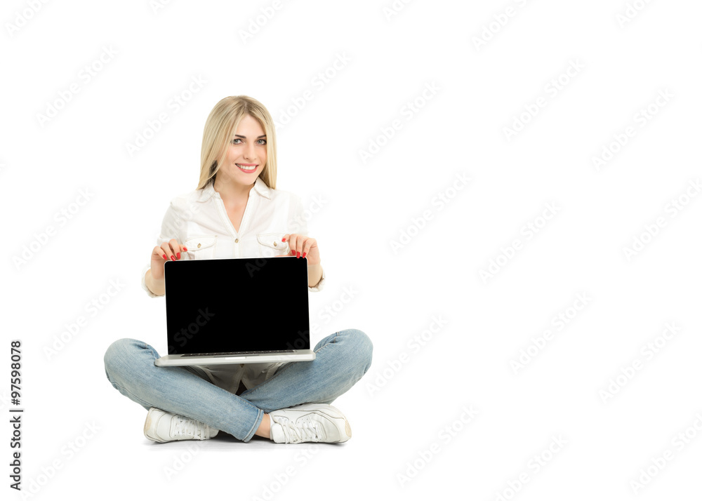 Young blonde woman showing blank laptop computer screen sitting Young blonde woman showing blank laptop computer screen sitting