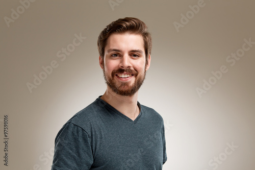 Smiling young 20s man with beard