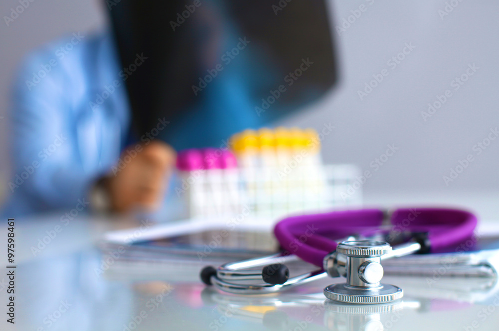 Doctor at work, close up of male doctor typing on a laptop Doctor at work, close up of male doctor typing on a laptop