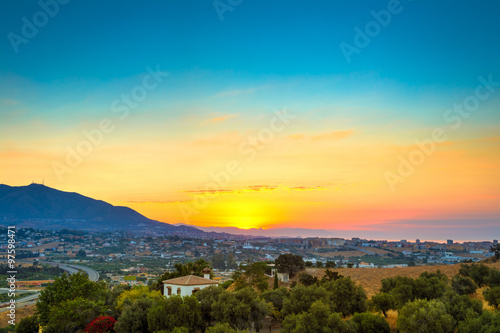 Fototapeta Beautiful Sunset Over Mountain, Mediterranean sea and town Mijas