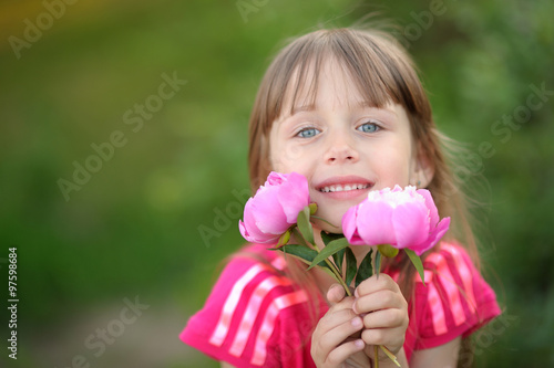 portrait of little girl outdoors in summer