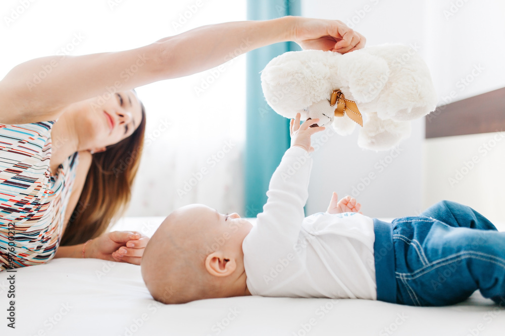 Baby playing with teddy bear Baby playing with teddy bear