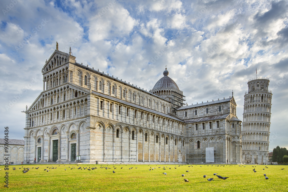 cathedral and tower of pisa under clouds in Italy