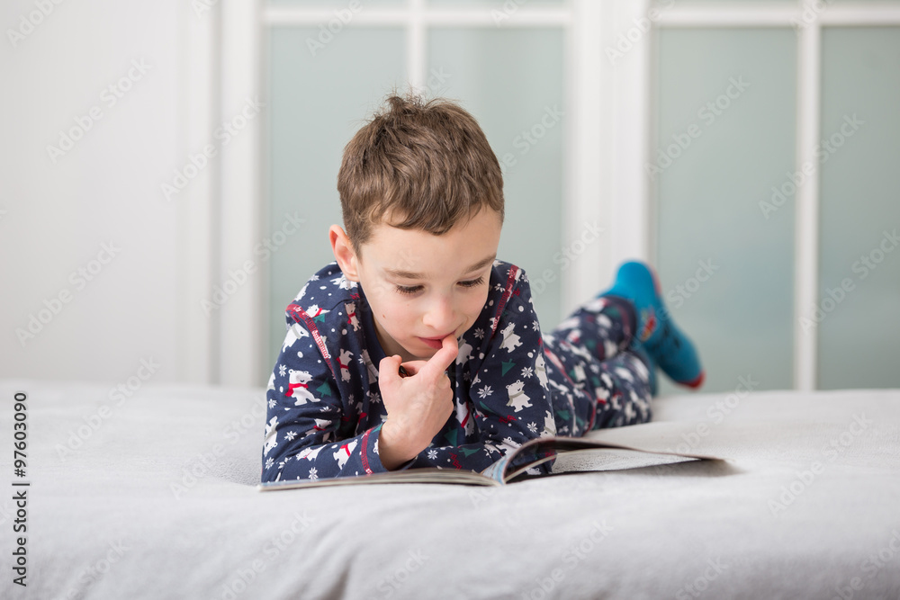 child reading in bed,
child reading in bed,