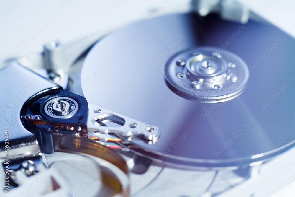 Opened Hard Disk Drive photographed with soft focus and soft flare with blue darktones Opened Hard Disk Drive photographed with soft focus and soft flare with blue darktones