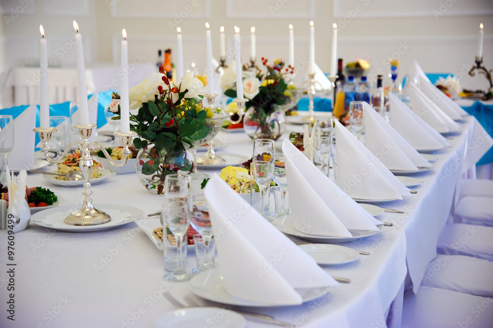 Festive table. Table setting. Festive round table with food. Starched napkins and Cutlery. Festive meals. Restaurant inside. Service holidays. Вesign of the hall. Festive table. Table setting. Festive round table with food. Starched napkins and Cutlery. Festive meals. Restaurant inside. Service holidays. Вesign of the hall.