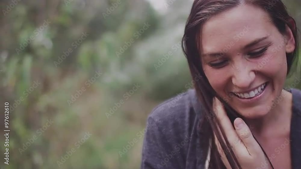 Closeup of a beautiful girl outside smiling and laughing, slow motion Closeup of a beautiful girl outside smiling and laughing, slow motion