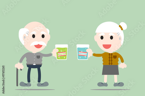 grandparent are holding denture in glass