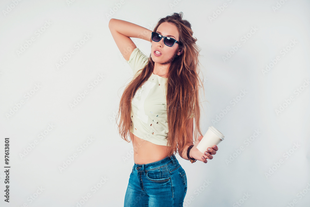 Young hipster woman with sunglasses and takeway coffee disposable cup Young hipster woman with sunglasses and takeway coffee disposable cup