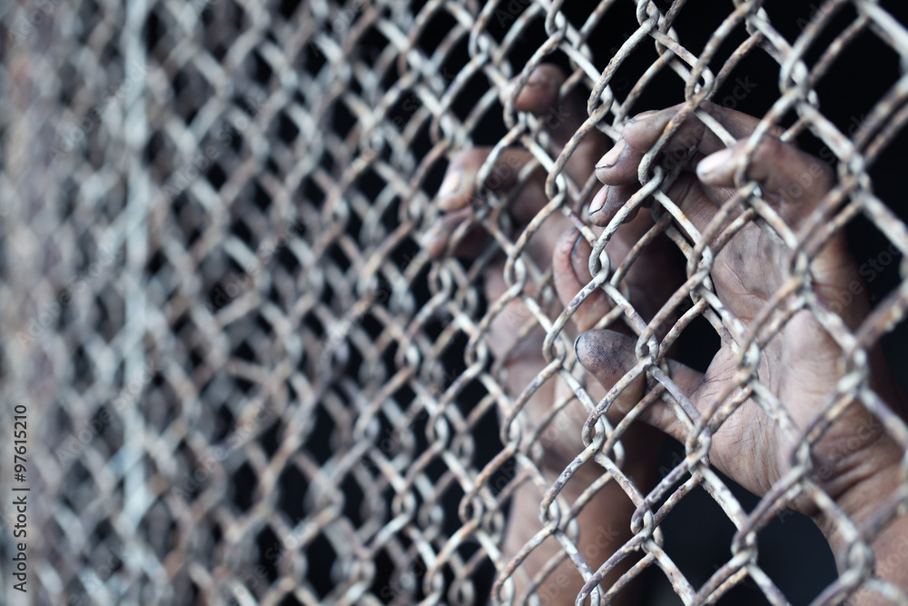Fototapeta premium dirty hand in jail