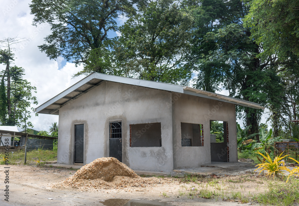 Newly built house with trees in the background, Trinidad, Trinidad And Tobago Newly built house with trees in the background, Trinidad, Trinidad And Tobago