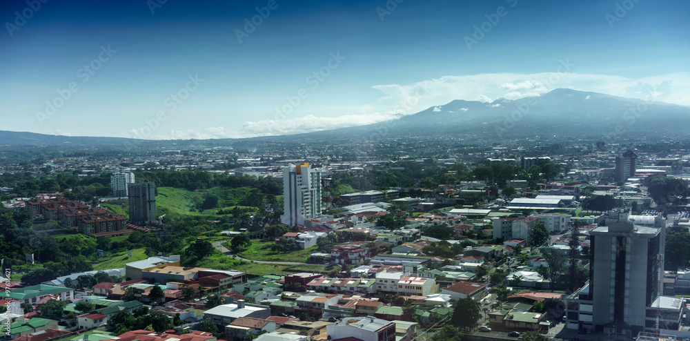 Aerial view of cityscape with mountain range in background, Costa Rica