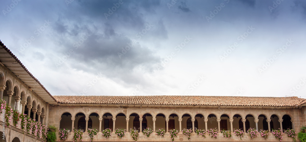 Low angle view of a church against cloudy sky, Cusco, Peru