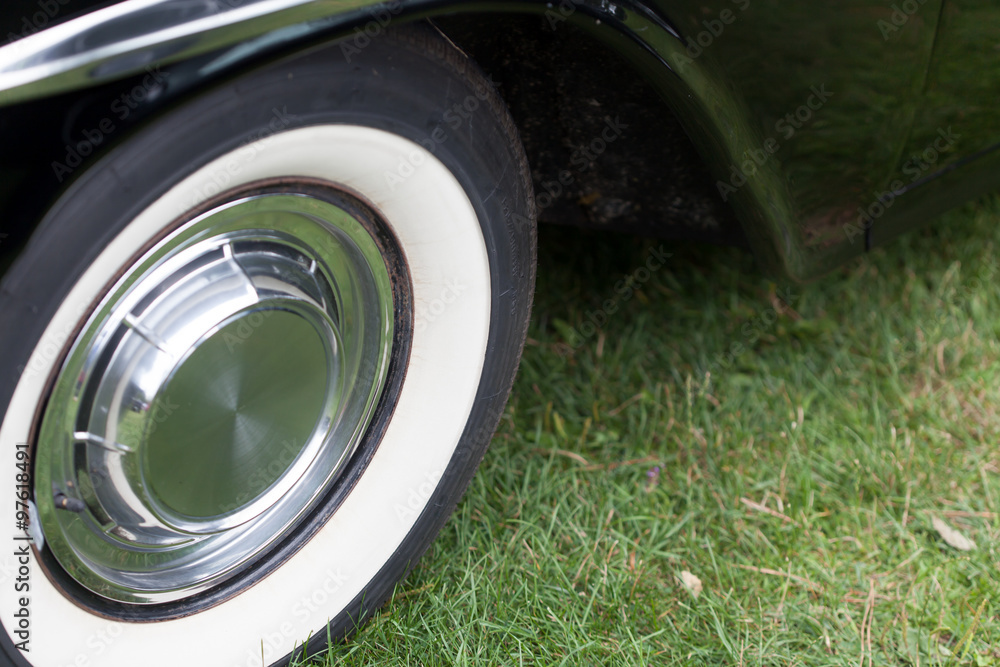 Close-up of tyre of a black classic vintage car Close-up of tyre of a black classic vintage car