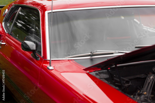 Wing mirror of a red shiny classic vintage car © bruno135_406