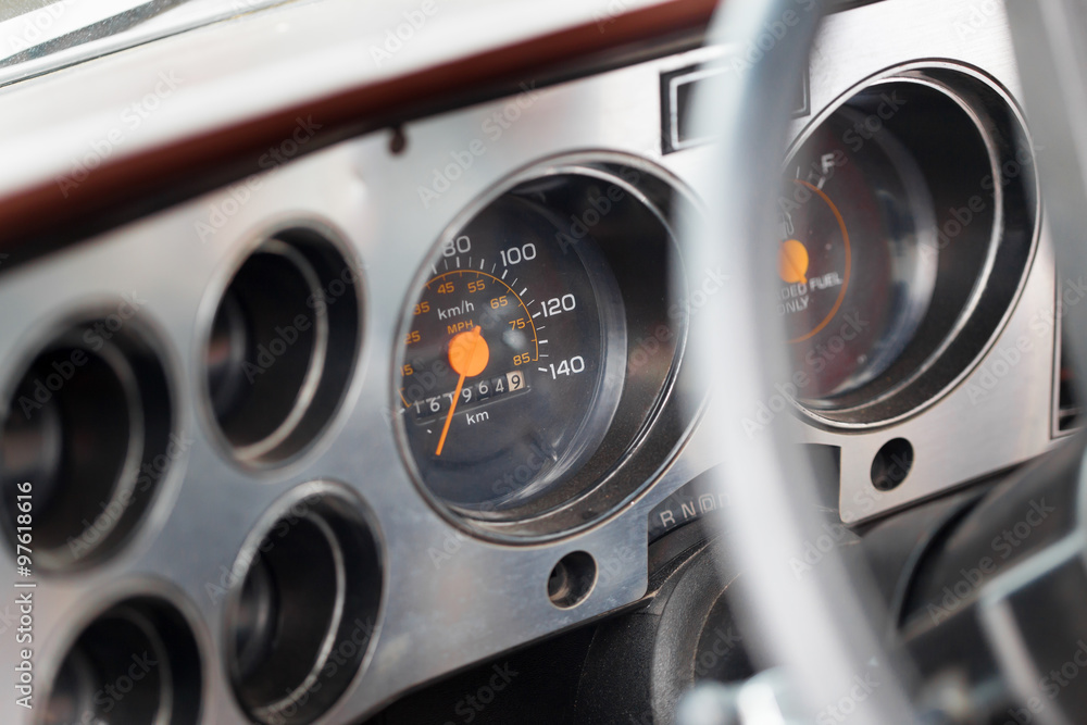 Close-up of speedometers of a classic vintage car