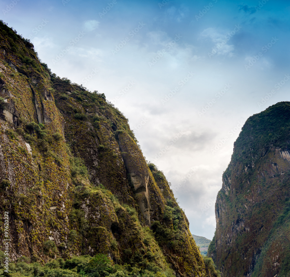 Low angle view of mountain range against cloudy sky, Machu Picchu, Cusco Region, Urubamba Province, Machupicchu District, Peru Low angle view of mountain range against cloudy sky, Machu Picchu, Cusco Region, Urubamba Province, Machupicchu District, Peru