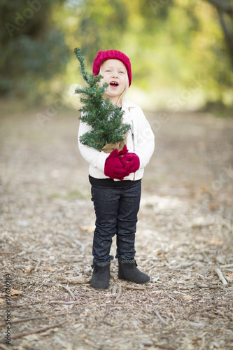Baby Girl In Red Mittens an...